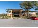 Community clubhouse with parking and landscaping at 2595 Royal Liverpool Dr, Tarpon Springs, FL 34688