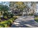 Gated community entrance with landscaped grounds and guard house at 2595 Royal Liverpool Dr, Tarpon Springs, FL 34688