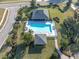 Aerial view of community pool, surrounding landscaping, and cabanas at 2595 Royal Liverpool Dr, Tarpon Springs, FL 34688