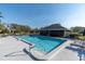 Clean and refreshing community pool with plenty of lounge chairs at 2595 Royal Liverpool Dr, Tarpon Springs, FL 34688