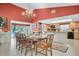 Bright dining room with an oval table and six chairs at 2595 Royal Liverpool Dr, Tarpon Springs, FL 34688