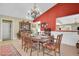 Elegant dining room with oval table and floral-patterned chairs at 2595 Royal Liverpool Dr, Tarpon Springs, FL 34688