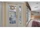 Inviting entryway with a view of a relaxing courtyard and hot tub at 2595 Royal Liverpool Dr, Tarpon Springs, FL 34688