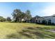 House exterior view showcasing the large backyard at 2595 Royal Liverpool Dr, Tarpon Springs, FL 34688