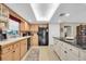 Modern kitchen with granite island and stainless steel appliances at 2595 Royal Liverpool Dr, Tarpon Springs, FL 34688