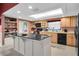 Modern kitchen with granite island and stainless steel appliances at 2595 Royal Liverpool Dr, Tarpon Springs, FL 34688