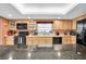 Modern kitchen with granite island and stainless steel appliances at 2595 Royal Liverpool Dr, Tarpon Springs, FL 34688