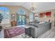 Spacious living room with gray sectional sofa at 2595 Royal Liverpool Dr, Tarpon Springs, FL 34688