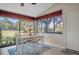 Sunroom dining area with golf course view at 2595 Royal Liverpool Dr, Tarpon Springs, FL 34688
