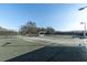 Well-maintained tennis courts with seating at 2595 Royal Liverpool Dr, Tarpon Springs, FL 34688