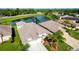 Stunning aerial view of a house near a lake in a quiet community at 2902 Punta Palma Ct, Holiday, FL 34691