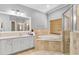 Bathroom with a large soaking tub, shower, and double vanity at 2902 Punta Palma Ct, Holiday, FL 34691