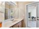 Bathroom with single sink vanity and access to backyard at 2902 Punta Palma Ct, Holiday, FL 34691
