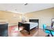 Spacious loft bedroom with wood floors and a large window at 2902 Punta Palma Ct, Holiday, FL 34691