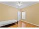 Simple bedroom with wood floors and a ceiling fan at 2902 Punta Palma Ct, Holiday, FL 34691