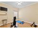 Home gym with wood floors and a ceiling fan at 2902 Punta Palma Ct, Holiday, FL 34691