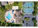 Community features a pool, tennis courts, and ample parking at 2902 Punta Palma Ct, Holiday, FL 34691