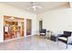 Covered patio with access to kitchen and seating area at 2902 Punta Palma Ct, Holiday, FL 34691