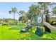 playground with swings and play equipment at 2902 Punta Palma Ct, Holiday, FL 34691