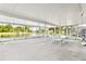 Spacious screened patio with ping pong table and lake view at 2902 Punta Palma Ct, Holiday, FL 34691