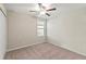 Well-lit bedroom with ceiling fan and double door closet at 313 Argyll Dr, Spring Hill, FL 34609