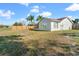 House exterior with large backyard and wooden fence at 3133 Covina St, New Port Richey, FL 34655