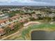 Aerial view of a villa community beside a golf course at 3417 Lori Ln # 2, New Port Richey, FL 34655