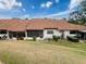 Property features a large backyard with a patio and lush landscaping at 3417 Lori Ln # 2, New Port Richey, FL 34655