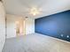 Spacious bedroom with blue wall and ample closet space at 3417 Lori Ln # 2, New Port Richey, FL 34655