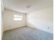 Bright bedroom with carpet flooring and a window at 3417 Lori Ln # 2, New Port Richey, FL 34655