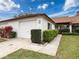 Front view of charming villa with attached garage and manicured landscaping at 3417 Lori Ln # 2, New Port Richey, FL 34655