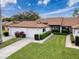 Two-car garage and landscaped yard at 3417 Lori Ln # 2, New Port Richey, FL 34655