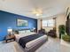 Spacious main bedroom with a king-size bed and two armchairs at 3417 Lori Ln # 2, New Port Richey, FL 34655