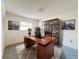 Home office features a large desk, bookcase and comfortable chair at 3417 Lori Ln # 2, New Port Richey, FL 34655