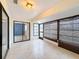 Sunroom with tiled floors and access to the backyard at 3417 Lori Ln # 2, New Port Richey, FL 34655