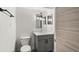 Updated bathroom with gray vanity and toilet at 4712 Stonepointe Pl, Tampa, FL 33634