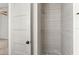 Clean bathroom with a shower and updated tile at 4712 Stonepointe Pl, Tampa, FL 33634