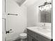 Modern bathroom with gray vanity and updated fixtures at 4712 Stonepointe Pl, Tampa, FL 33634