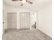 Spacious bedroom with ceiling fan and ample closet space at 4712 Stonepointe Pl, Tampa, FL 33634