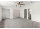 Large bedroom with ceiling fan and double closets at 4712 Stonepointe Pl, Tampa, FL 33634