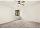 Bright bedroom with gray carpet and a window at 4712 Stonepointe Pl, Tampa, FL 33634