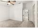 Bright bedroom with ceiling fan and access to another room at 4712 Stonepointe Pl, Tampa, FL 33634