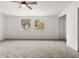 Bright bedroom with ceiling fan and large windows at 4712 Stonepointe Pl, Tampa, FL 33634