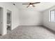 Spacious bedroom with ceiling fan and ensuite bathroom at 4712 Stonepointe Pl, Tampa, FL 33634