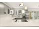 Modern kitchen with stainless steel appliances and quartz countertops at 4712 Stonepointe Pl, Tampa, FL 33634