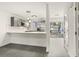 Modern kitchen with grey cabinets, white countertops, and stainless steel appliances at 4712 Stonepointe Pl, Tampa, FL 33634