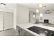 Kitchen with an eat-in island and view into living room at 4712 Stonepointe Pl, Tampa, FL 33634
