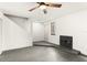 Living room with grey flooring, fireplace, and access to outdoor space at 4712 Stonepointe Pl, Tampa, FL 33634