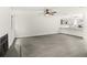 Open living room with grey vinyl flooring and modern fireplace at 4712 Stonepointe Pl, Tampa, FL 33634