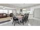 Bright dining area with table and chairs, view into living room at 4737 Sandpointe Dr, New Port Richey, FL 34655